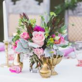 Pink centerpiece with brass vases