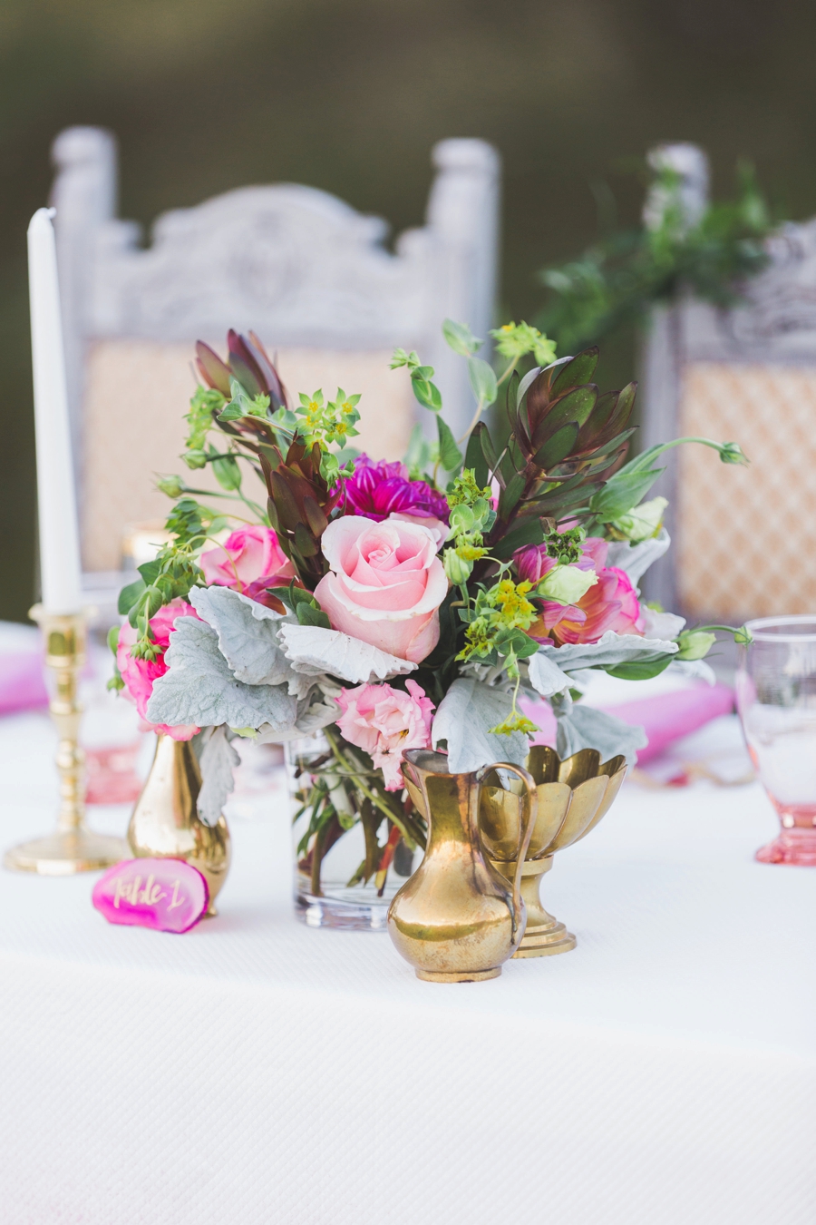 Pink centerpiece with brass vases