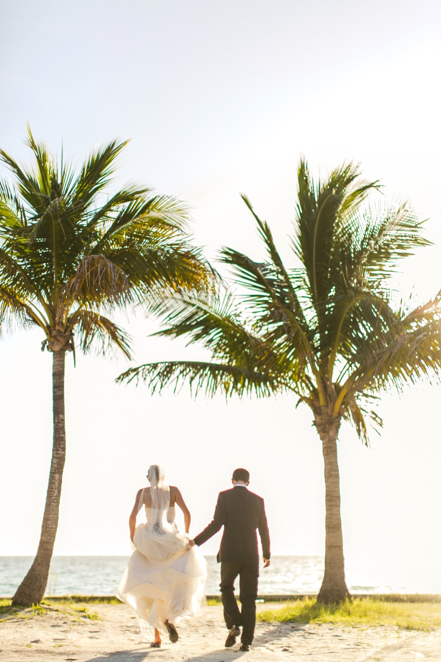 Aqua & White Oceanside Florida Wedding via TheELD.com