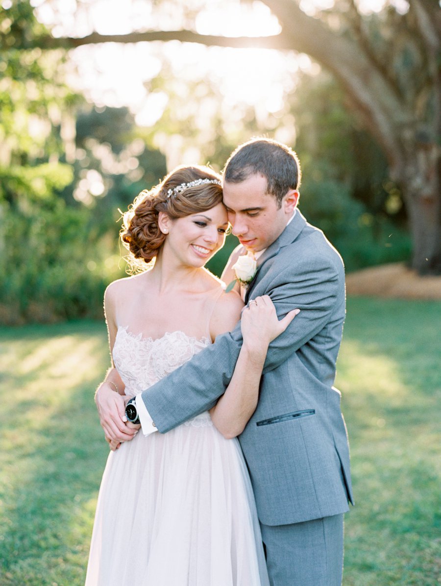 A Romantic Blush and White Rustic Florida Barn Wedding via TheELD.com