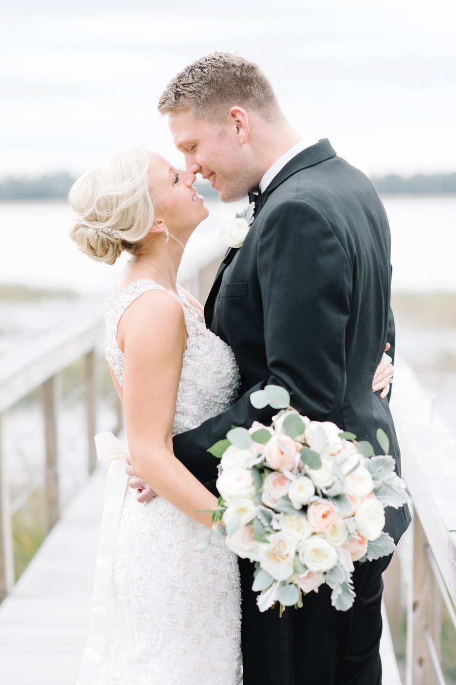 A White and Teal Southern Charleston Wedding via TheELD.com