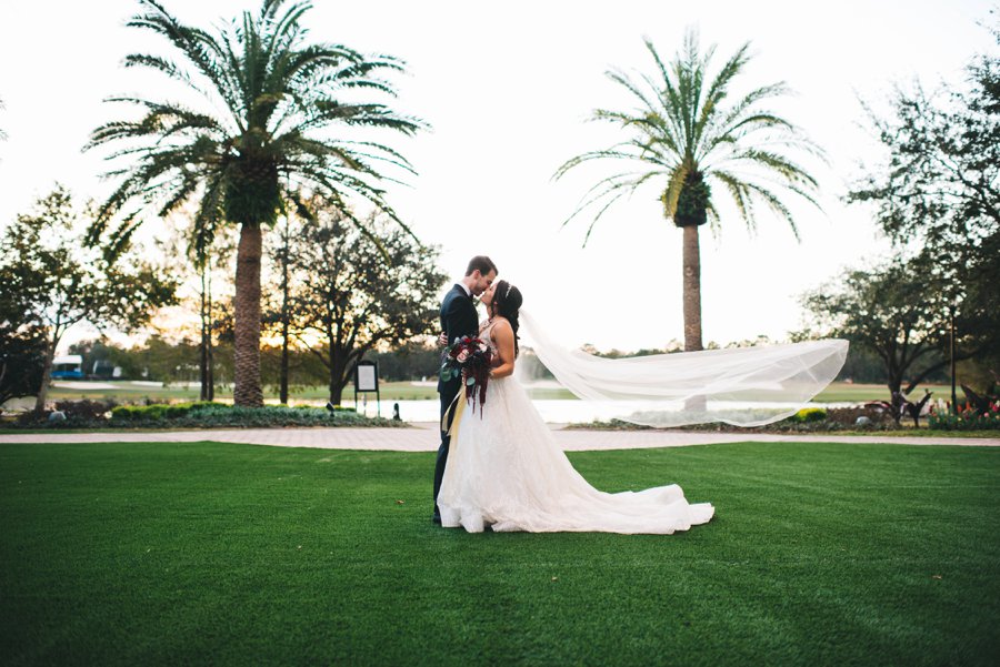 An Elegant Burgundy and Navy Fairytale Orlando Wedding Day via TheELD.com