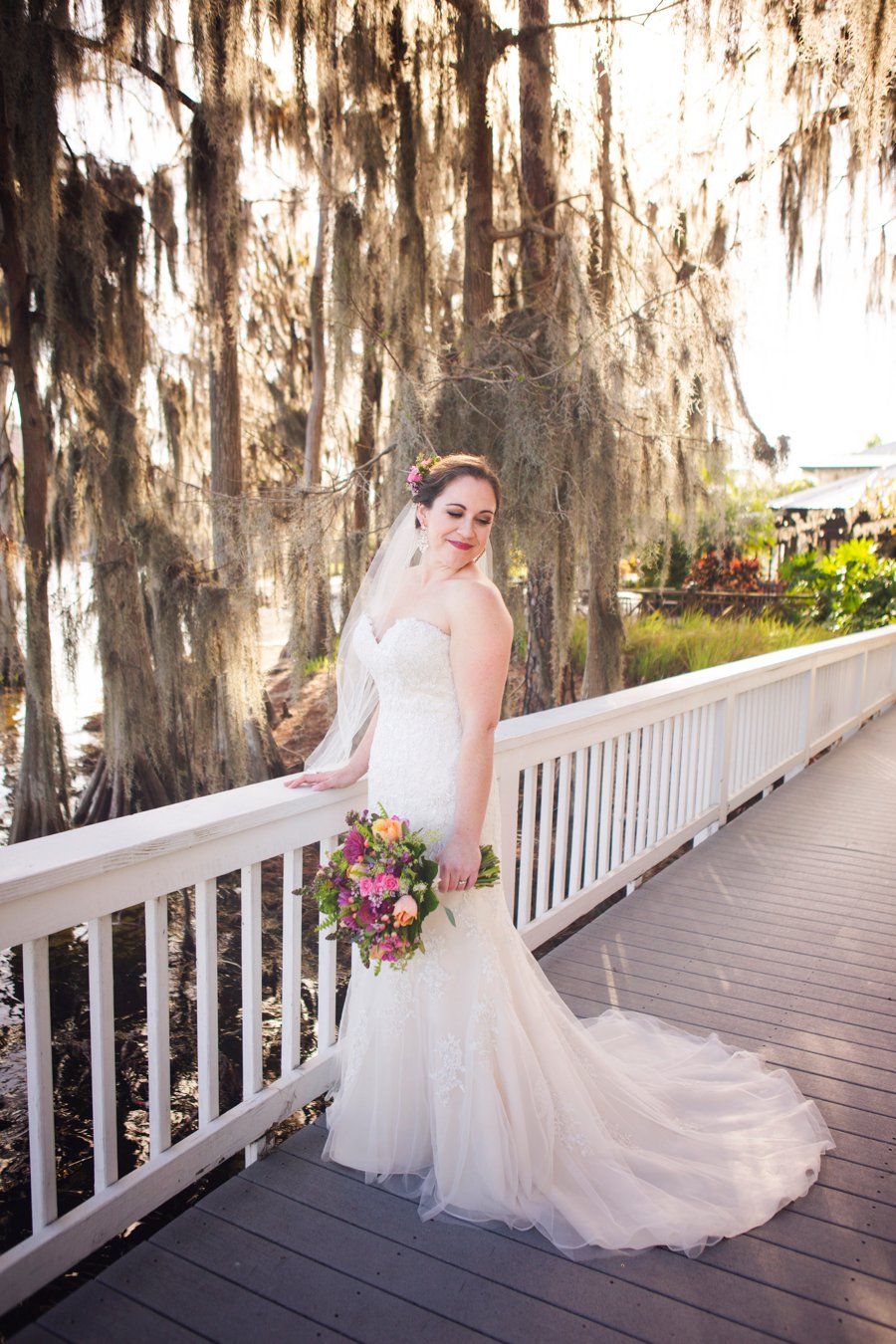 A Colorful Floral Waterfront Central Florida Wedding Day via TheELD.com