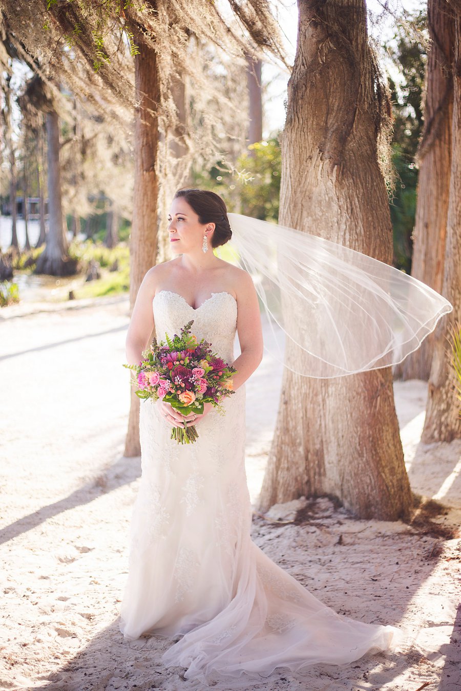 A Colorful Floral Waterfront Central Florida Wedding Day via TheELD.com