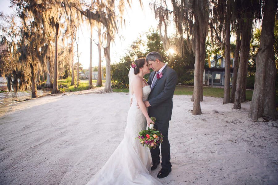 A Colorful Floral Waterfront Central Florida Wedding Day via TheELD.com