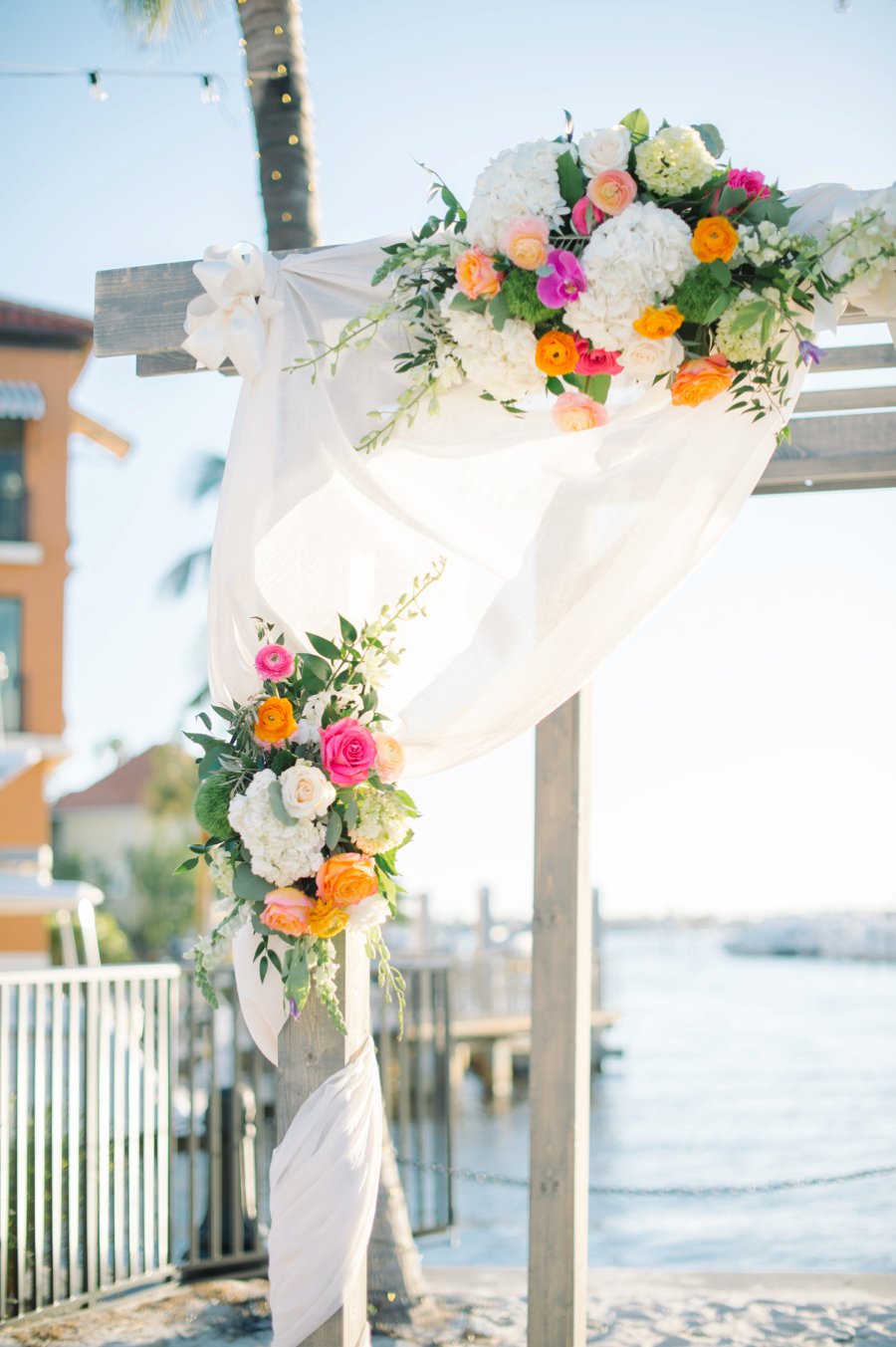 A Colorful Navy, Orange, & Pink Preppy Naples Wedding Day via TheELD.com