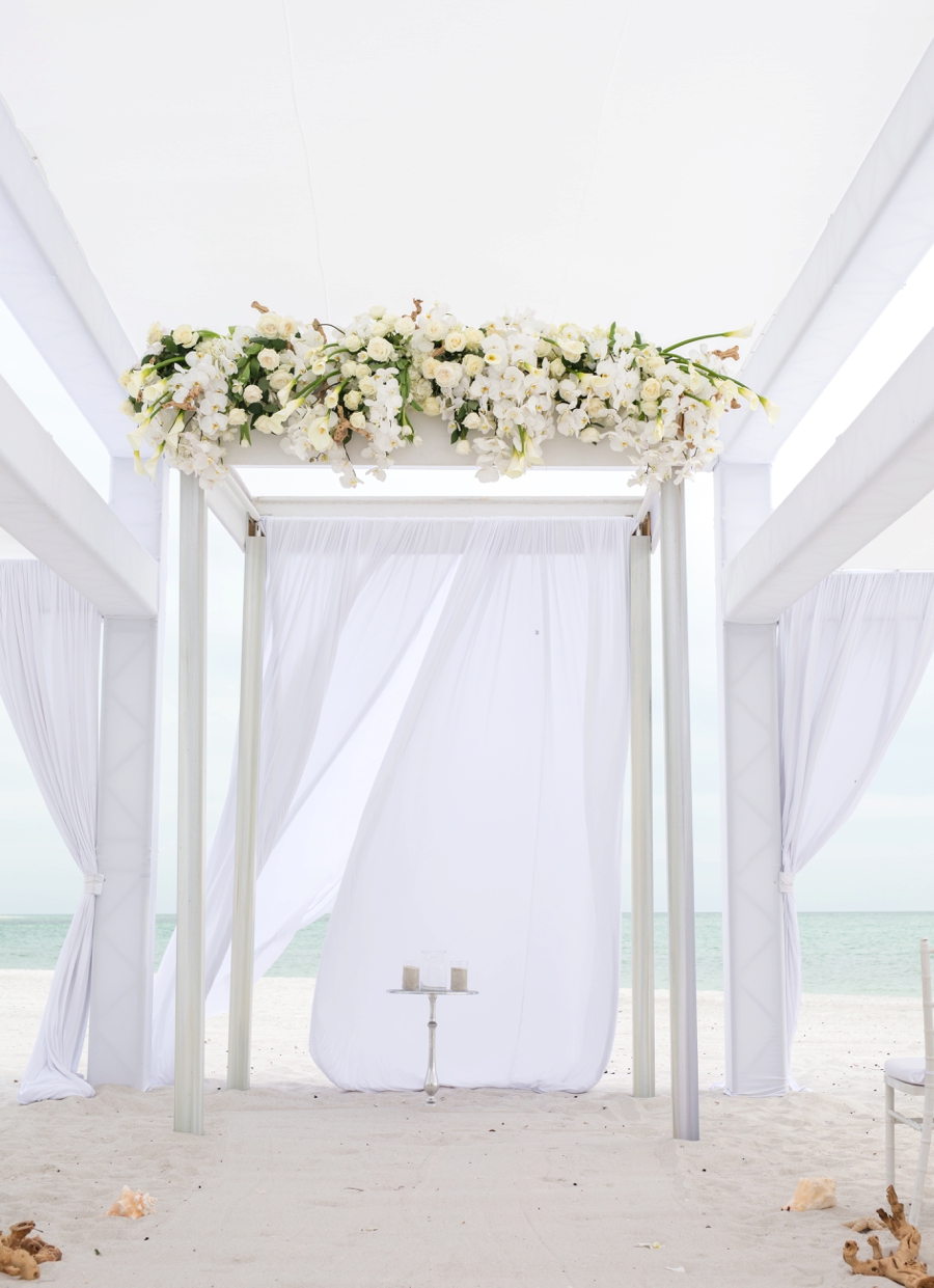 An Elegant & Luxe White Beach Wedding via TheELD.com